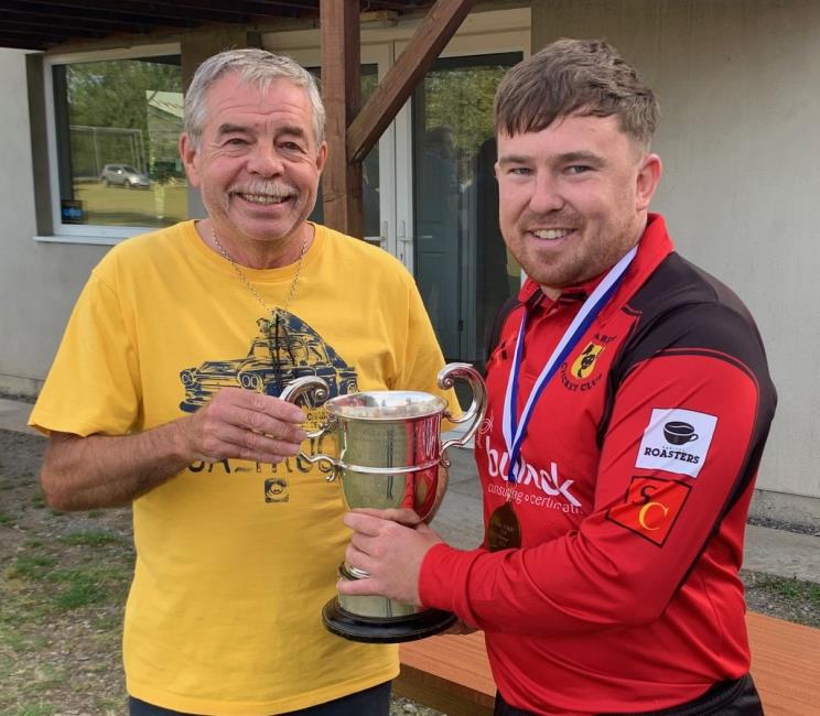 Pembroke president Kevin Jenkins presents the Colley Cup to Jacob Knox
